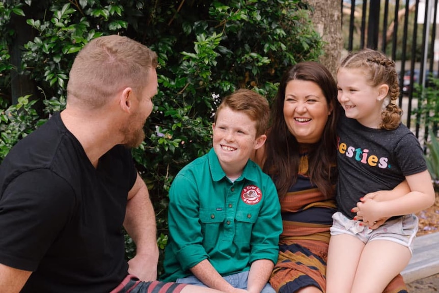 10-year-old Jack Berne sitting with his family