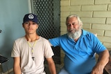 Kenny Rogan sits with his father Colin