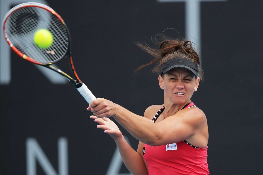 Casey Dellacqua plays a forehand against Karin Knapp at the Hobart International