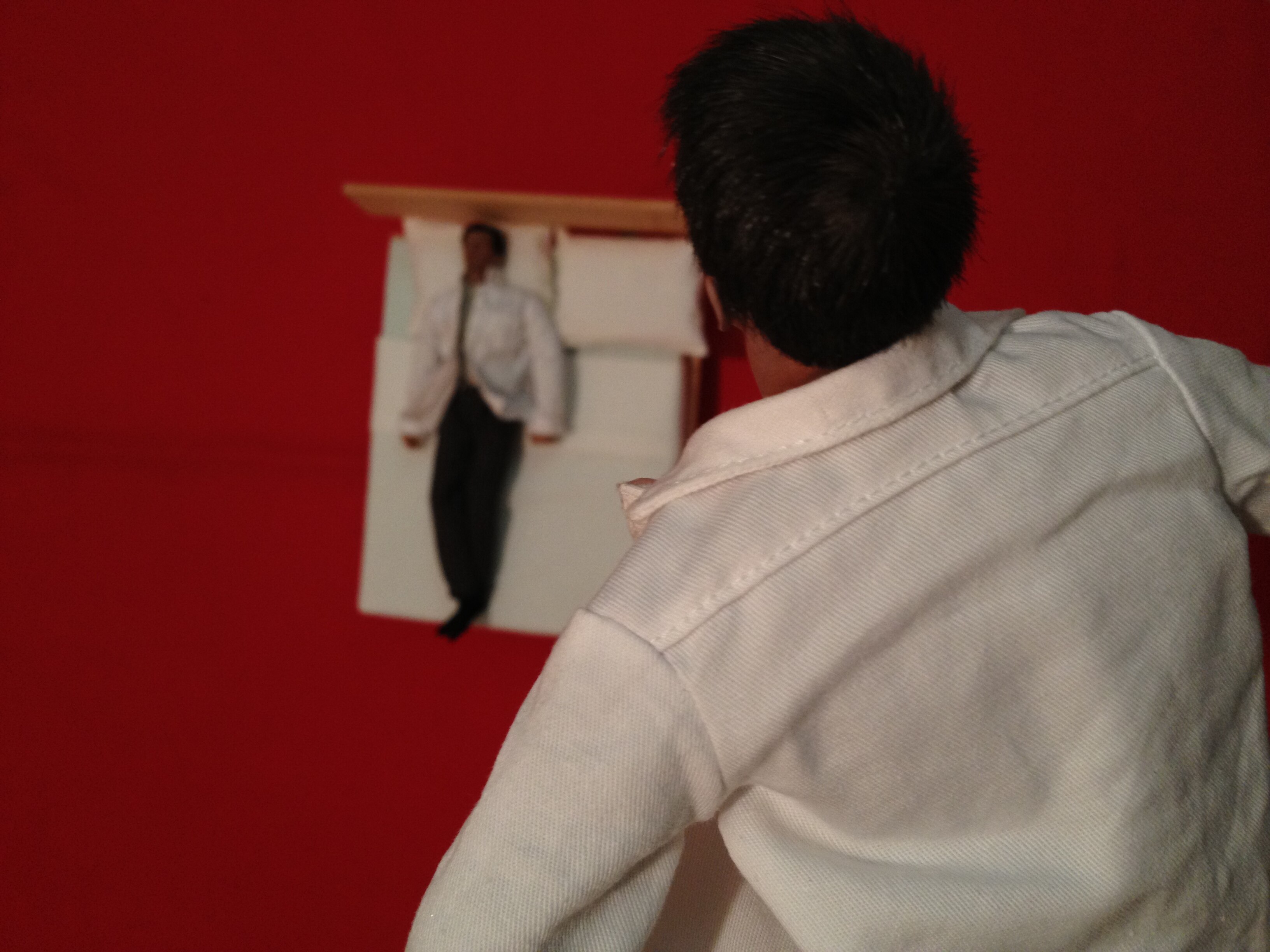 Man floating above his own body and looking down during an out-of-body experience or in the afterlife.