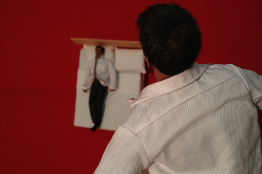 Man floating above his own body and looking down during an out-of-body experience or in the afterlife.