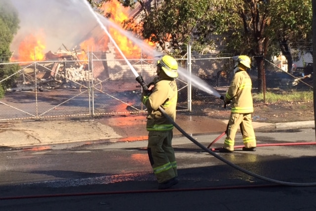 Firefighters battling a furniture factory fire at Yennora