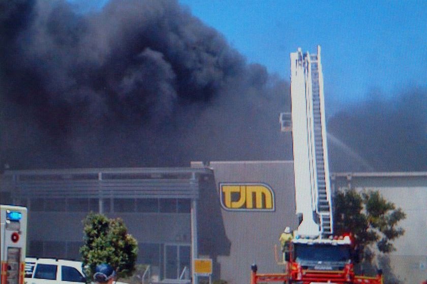 Firefighters are still at the scene of this blaze in the industrial estate in Geebung.