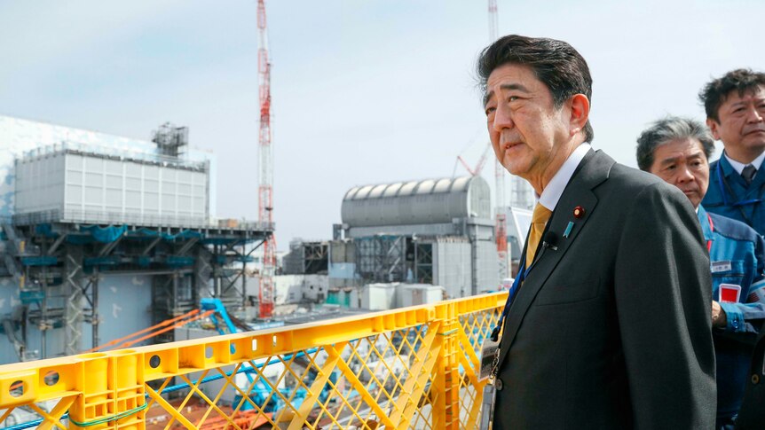 Japanese Prime Minister Shinzo Abe looks concerned as he looks out over the Fukushima plant.