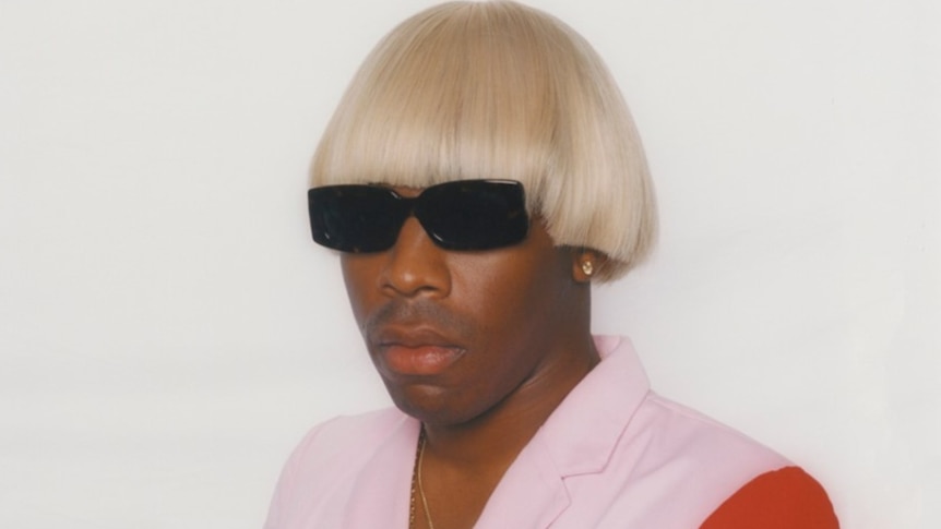 Tyler, The Creator in blonde wig and glasses
