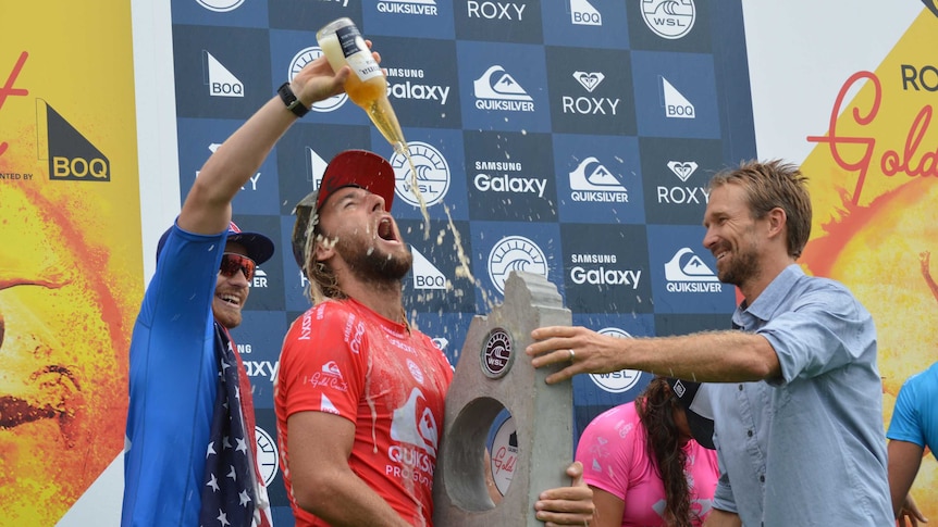 On top ... Matt Wilkinson celebrates his victory at Snapper Rocks