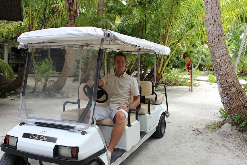 Boris Kopec, The Brando Resort's Sustainable Development Coordinator, in a golf buggy