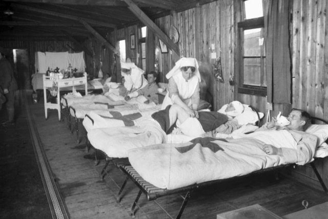 Australian nurses treat men in the Australian Casualty Clearing Station near Steenvoorde.