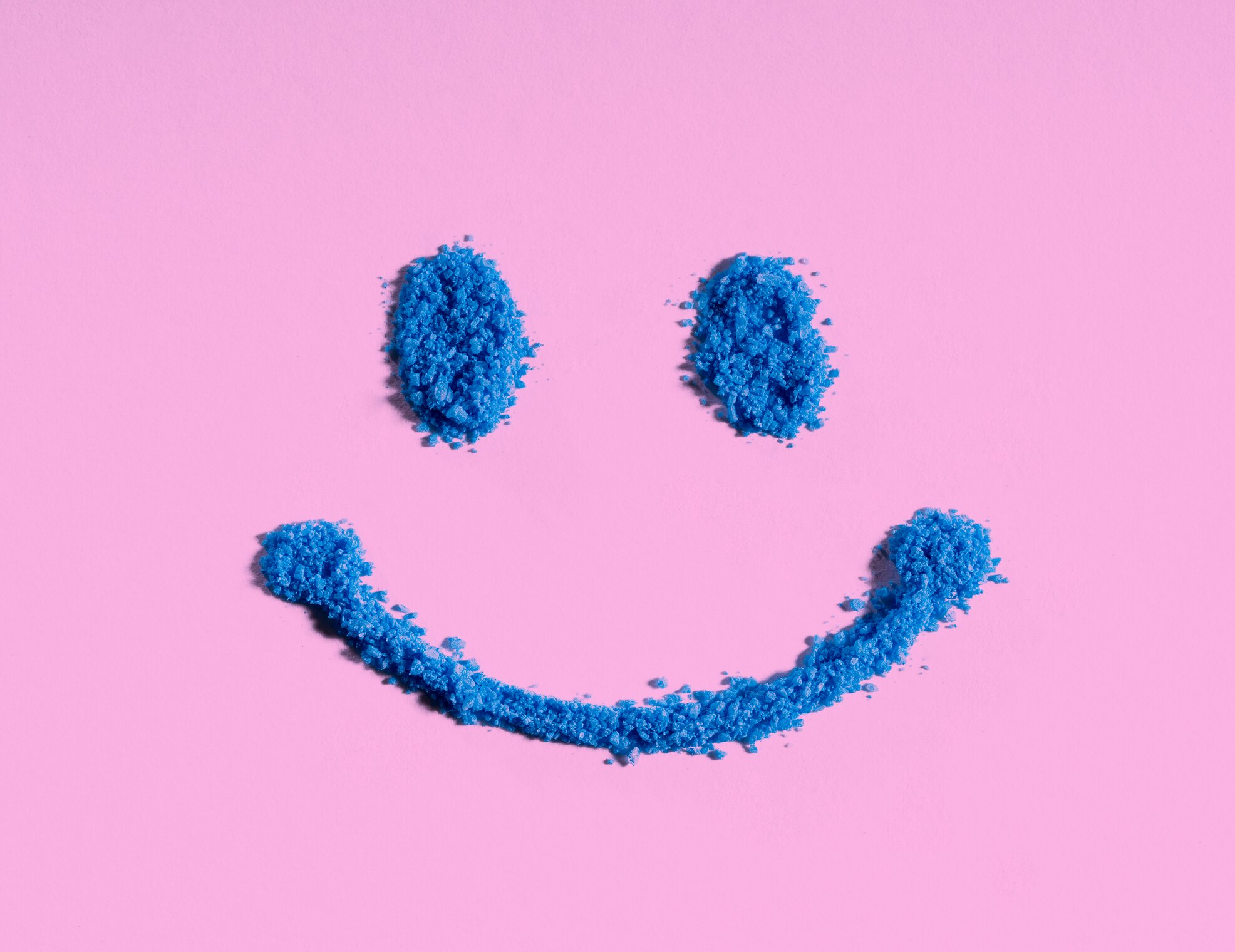 blue smile face on pink background