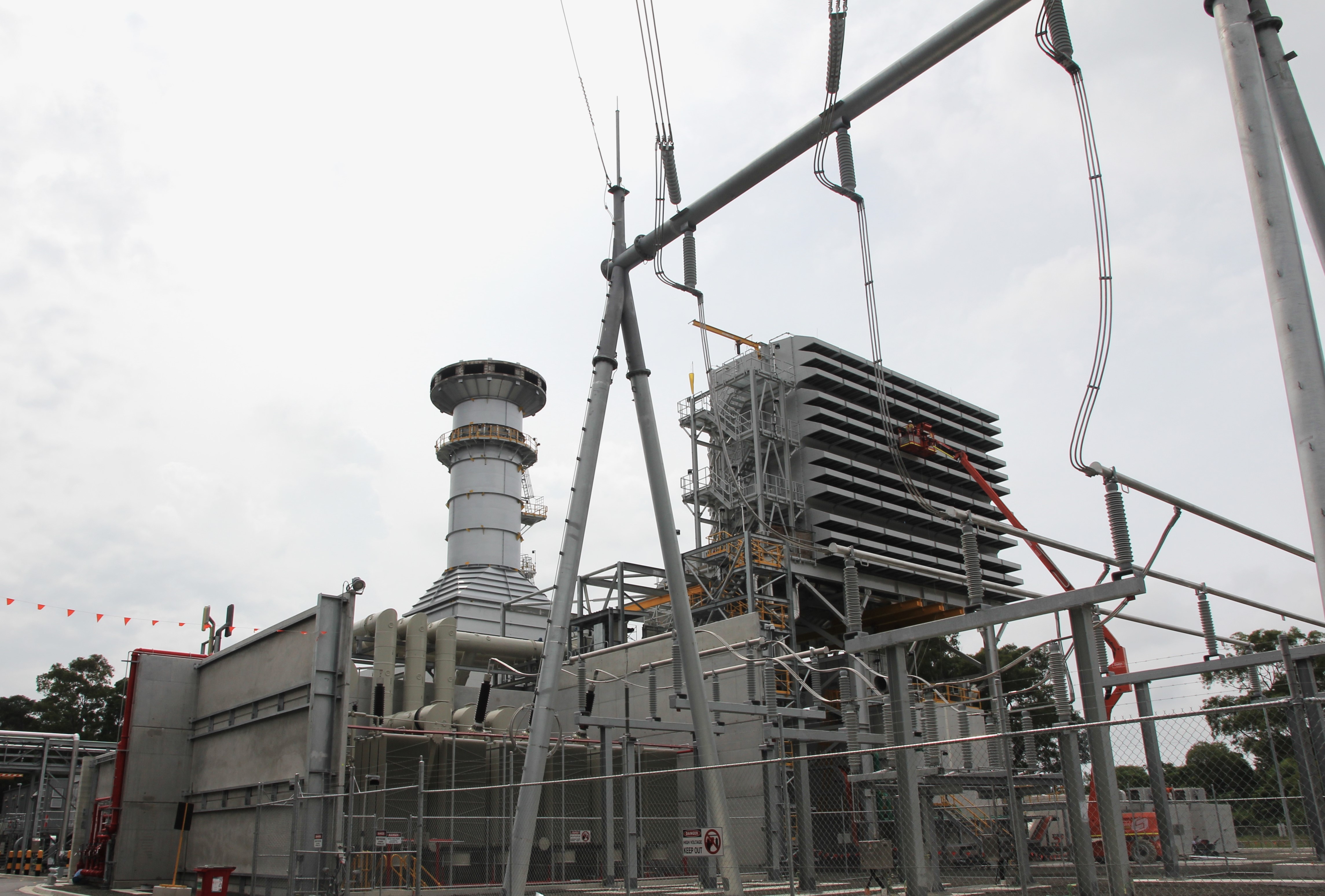 Power plant with power lines in foreground
