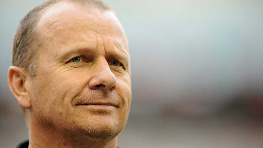 Port Adelaide coach Ken Hinkley watches his team warm-up at Docklands on February 25, 2014.