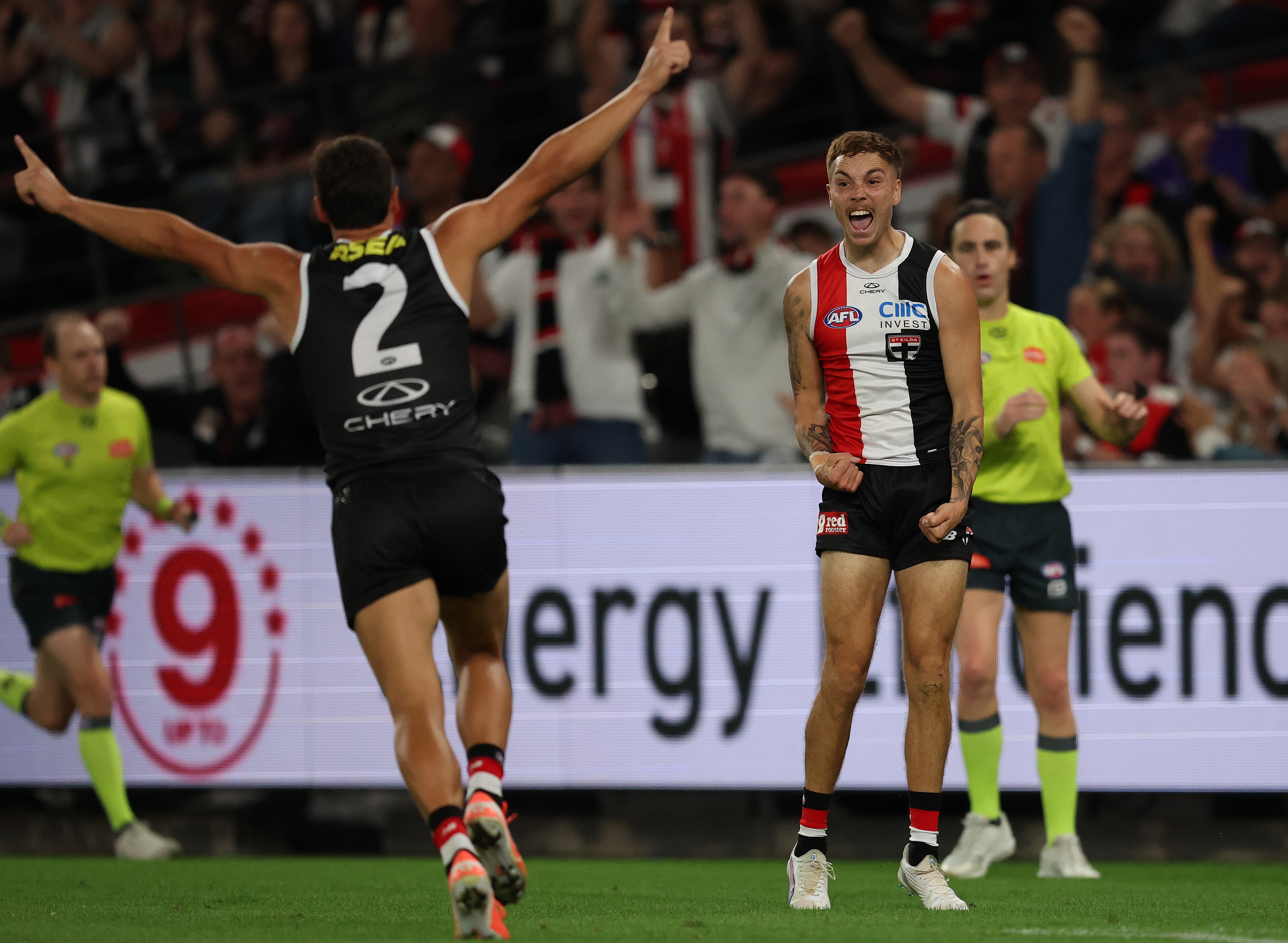 Lance Collard celebrates a goal with teammate