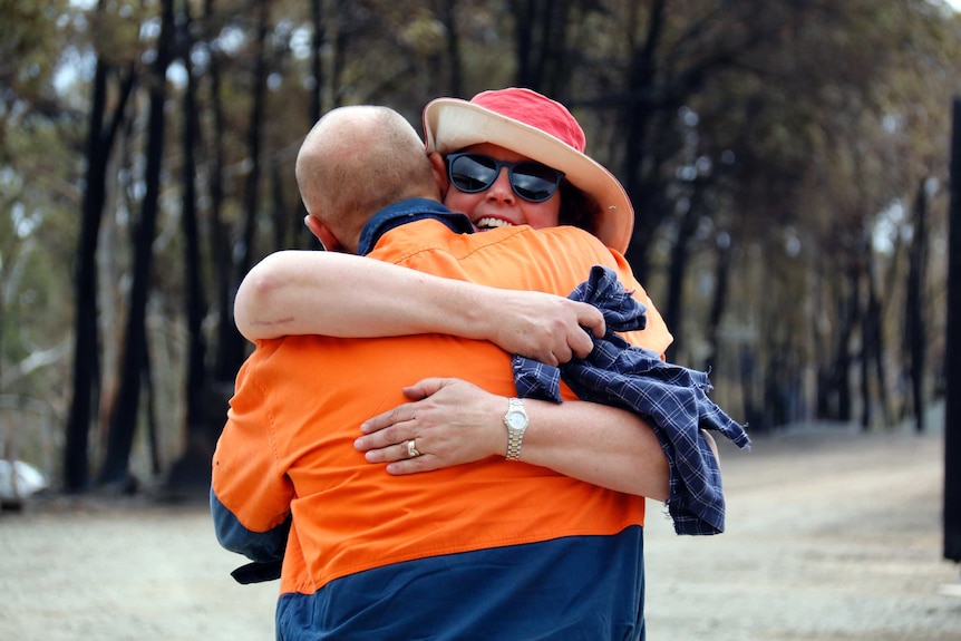 Vanessa Lindley embraced by a friend.