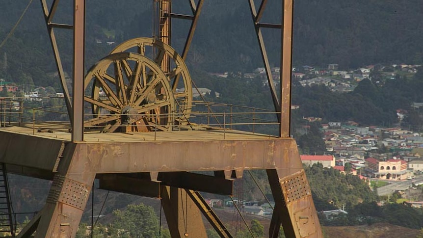 Headframe at the Mount Lyell copper mine with Queenstown backdrop.