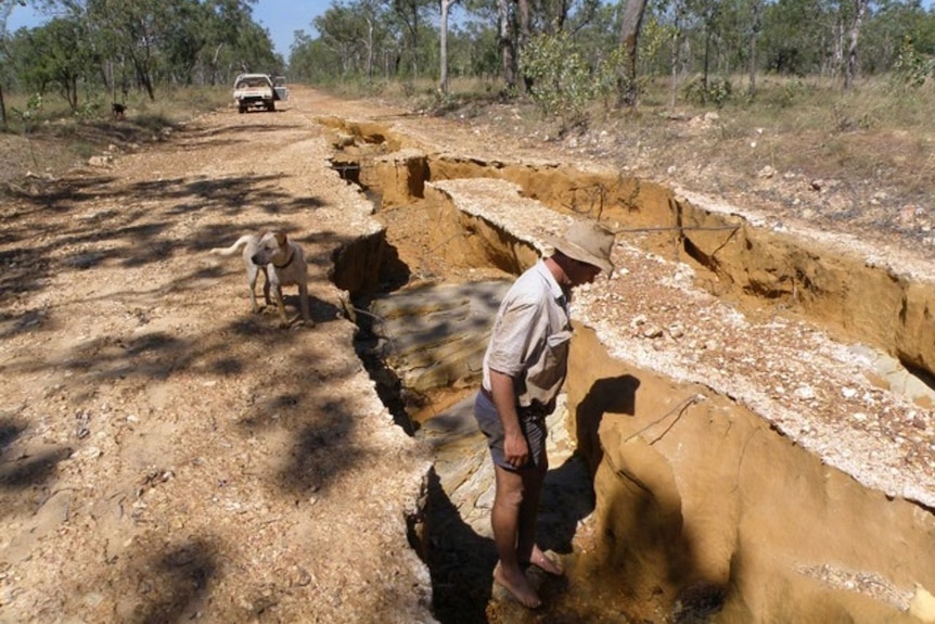 A very badly water-damaged road.