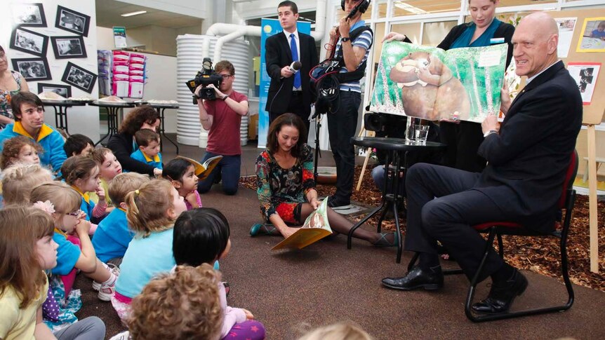 School Education Minister Peter Garrett (right) reads to children