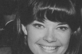 A black and white headshot of a woman