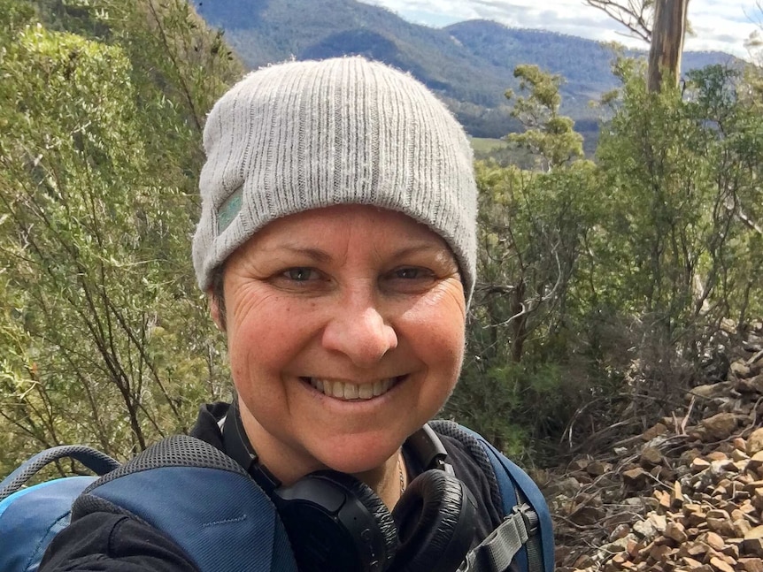 Former Olympic cyclist Julie Speight on a bushwalk wearing a beanie.