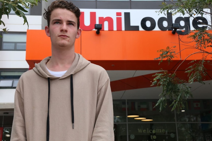 Jeremy Butler stands outside the UniLodge at the Australian National University