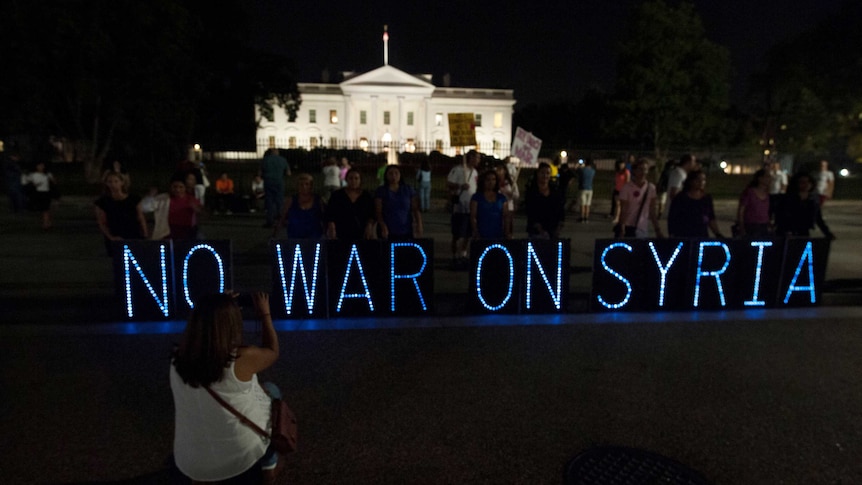 Syria protest Anti-war protesters hold vigil outside the White House