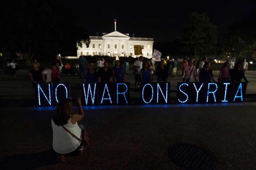 Anti-war protesters hold vigil outside the White House