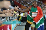 South Africa's Caster Semenya celebrates with fans after winning the woman's 800m final.