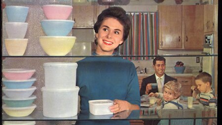 A woman looks at Tupperware in some of the company's marketing material.