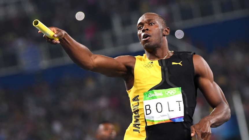 Bolt celebrates after Jamaica wins the men's 4x100m relay