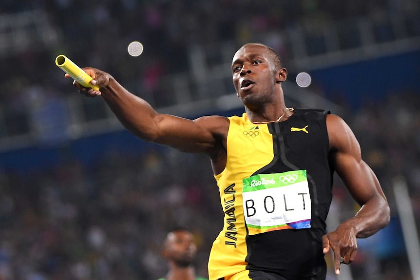 Bolt celebrates after Jamaica wins the men's 4x100m relay