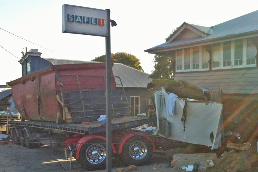 A driver was trapped for four hours after crashing his truck into a house on Ipswich Road at Annerley on October 23rd 2012.