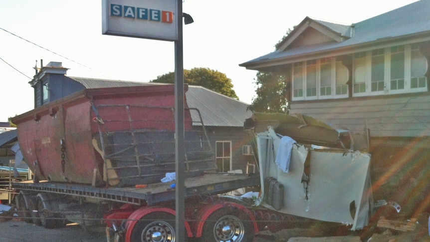 A driver was trapped for four hours after crashing his truck into a house on Ipswich Road at Annerley on October 23rd 2012.