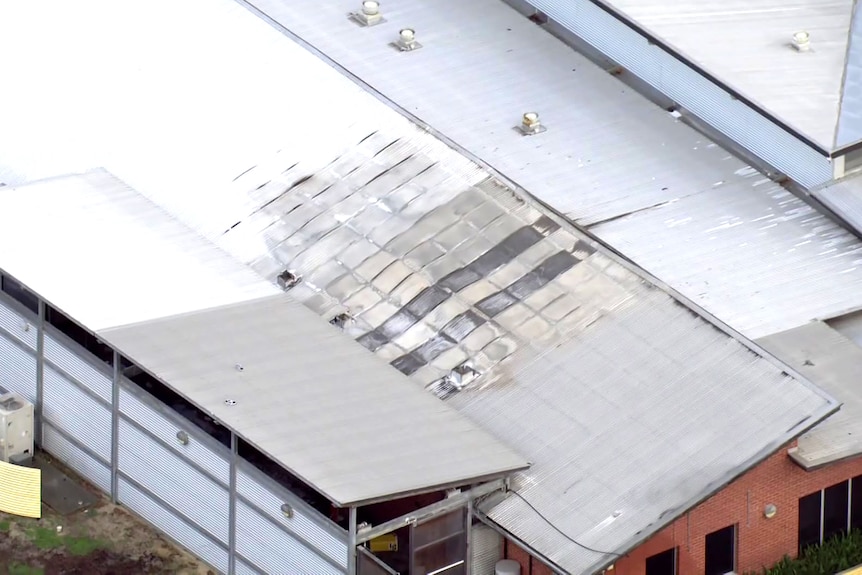 An aerial shot showing the roof of a building damaged by fire at Banksia Hill Juvenile Detention Centre.