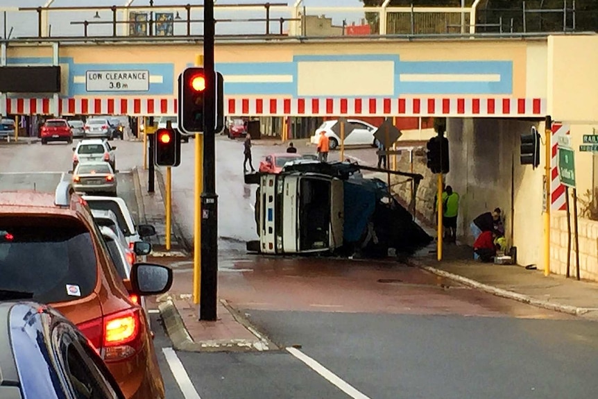 Truck overturned under Bayswater bridge