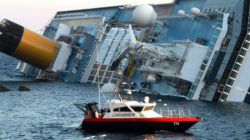 A rescue boat circles the Costa Concordia after the cruise ship ran aground last year.