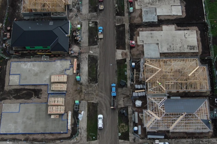 An aerial view of homes being built.