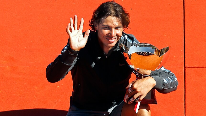 Nadal poses with his Monte Carlo trophy