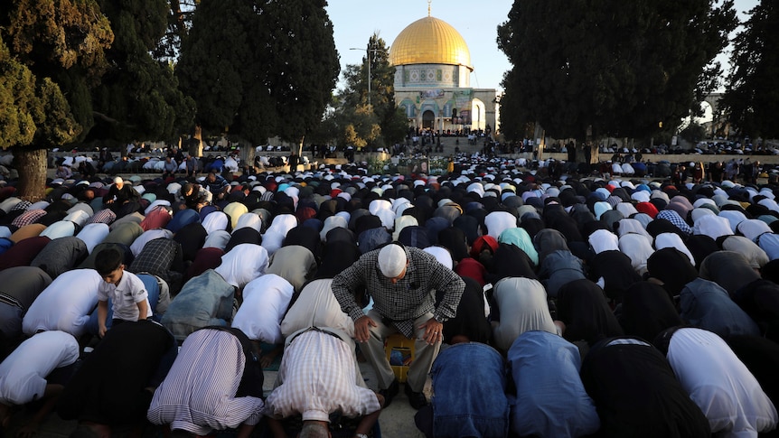 Thousands of Muslims take part in Eid al-Fitr prayers at the Dome of the Rock Mosque. 