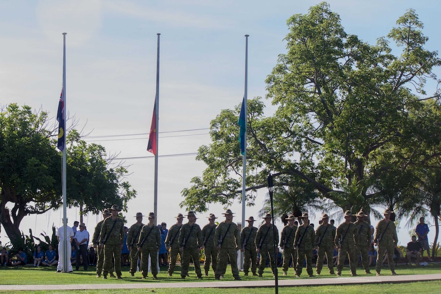 Soldiers attend the memorial service for the 75th anniversary of the Japanese attack on Broome.
