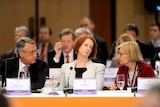 Wayne Swan and Julia Gillard listen to Heather Ridout