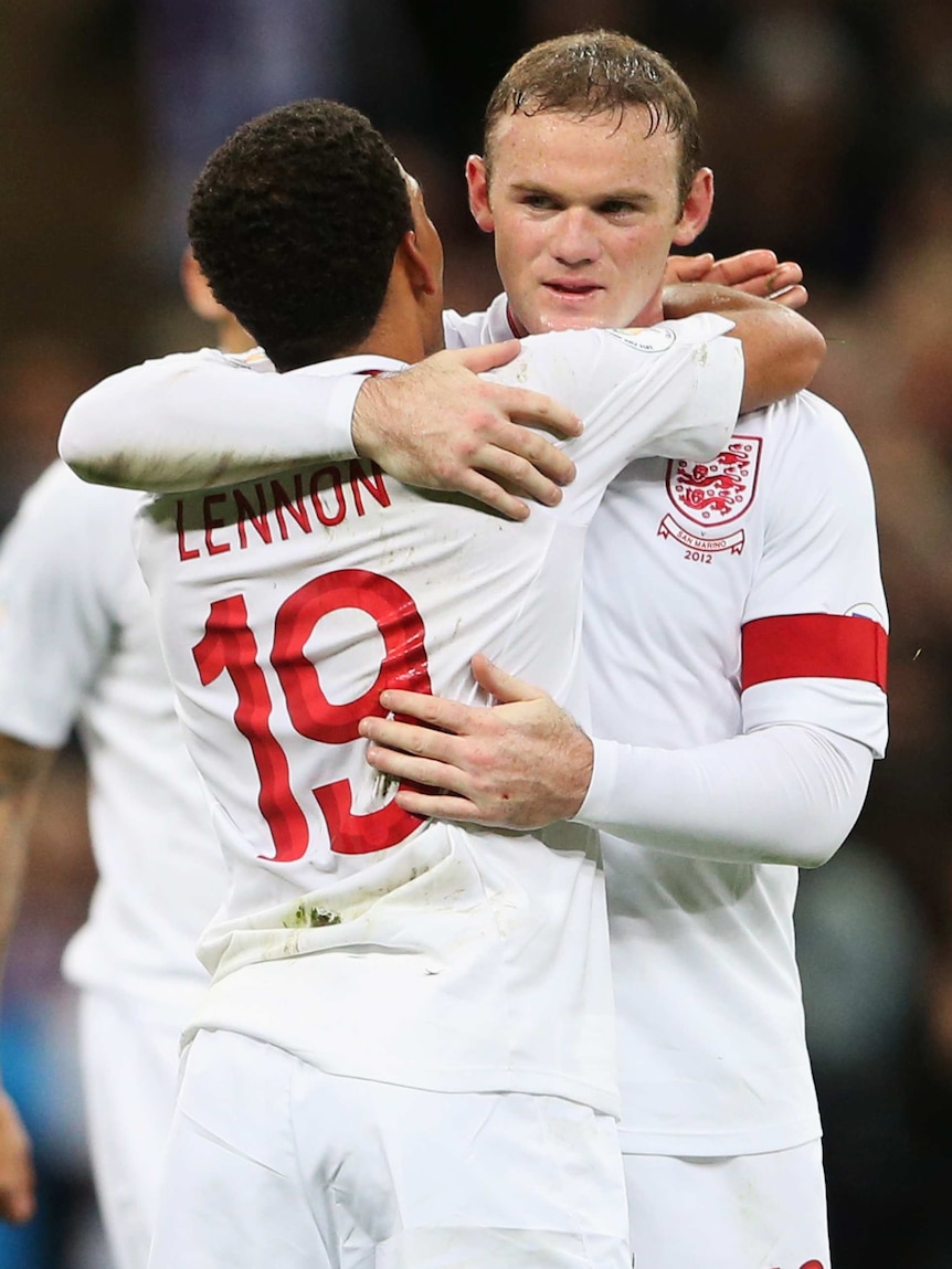 On target ... Wayne Rooney (L) celebrates England's win with Aaron Lennon
