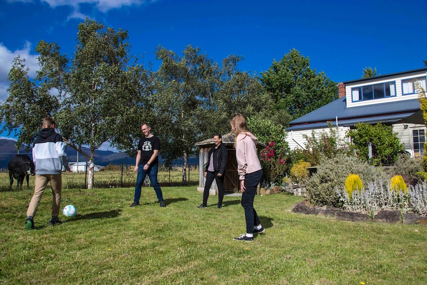 A family playing football.