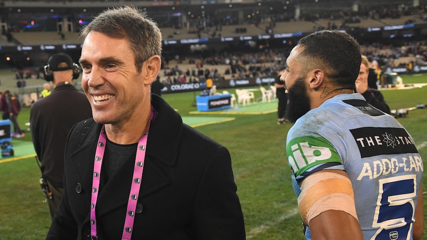 Brad Fittler smiles as he walks past Josh Addo-Carr after State of Origin I.