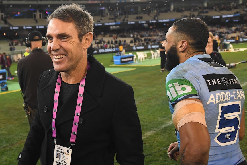 Brad Fittler smiles as he walks past Josh Addo-Carr after State of Origin I.