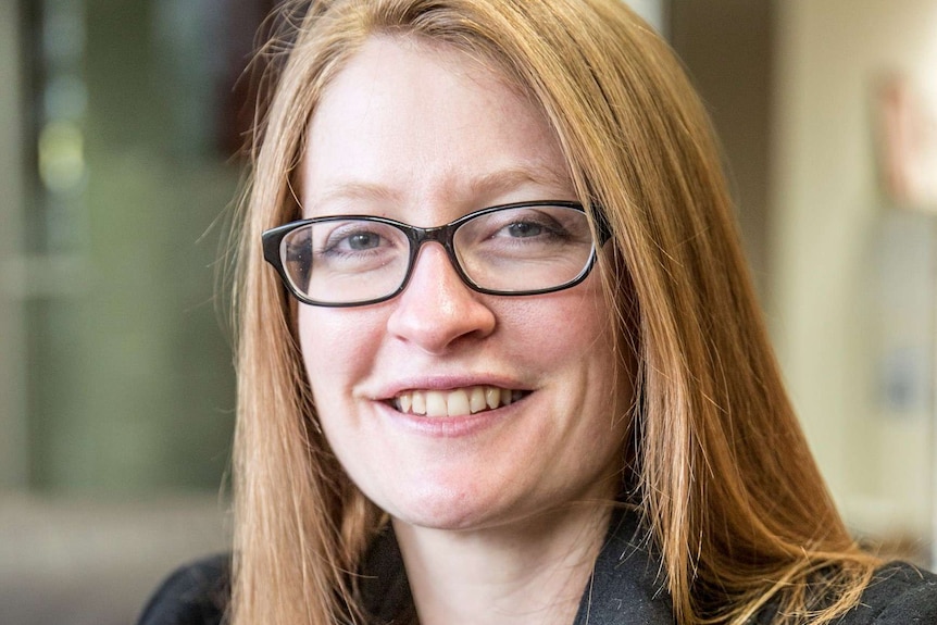 A headshot of a woman.