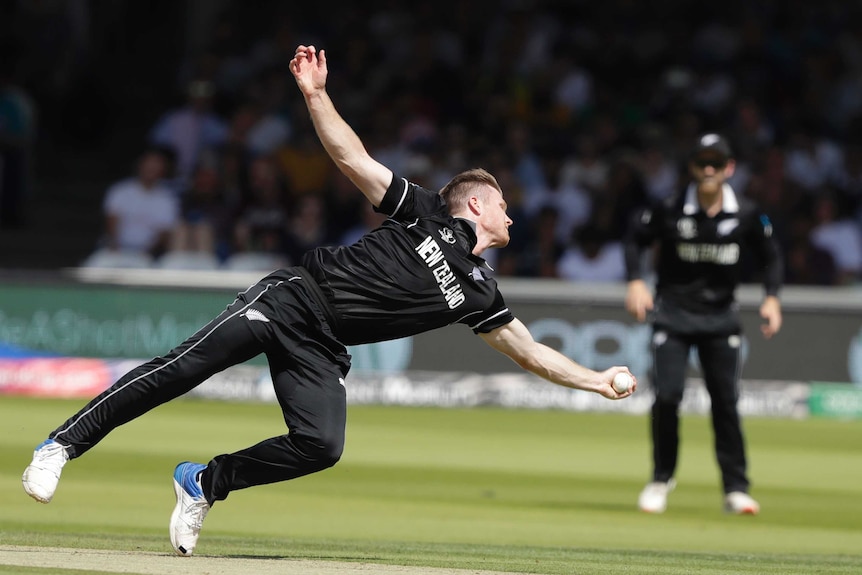 New Zealand bowler Jimmy Neesham is outstretched as he catches out Australia batsman Glenn Maxwell at the Cricket World Cup.