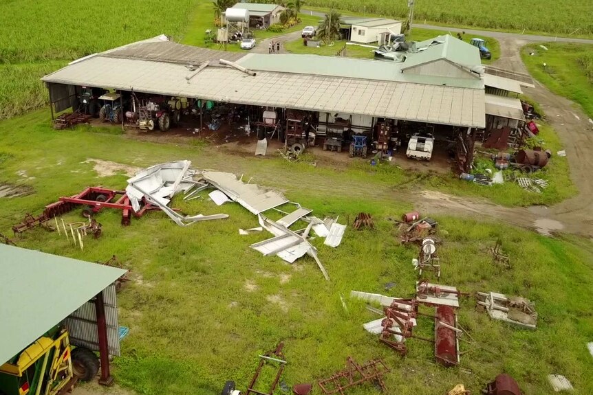 Aerial shot of sheds with debris across the farm.