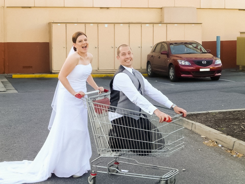 Kelly and her husband Justin in a supermarket shopping trolley