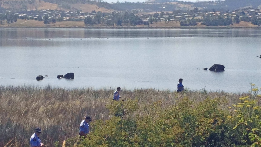 Tasmanian police search the banks of the River Derwent near Granton after a robbery at the York Hotel.