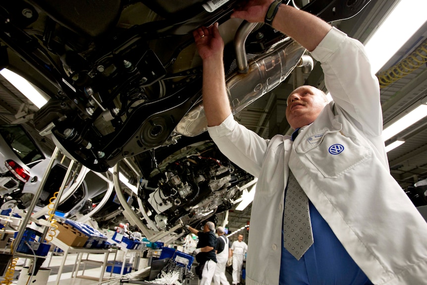 Volkswagen engineer working in the factory