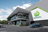 A digital artist impression of a warehouse design with a large Woolworths sign and a carpark out front.